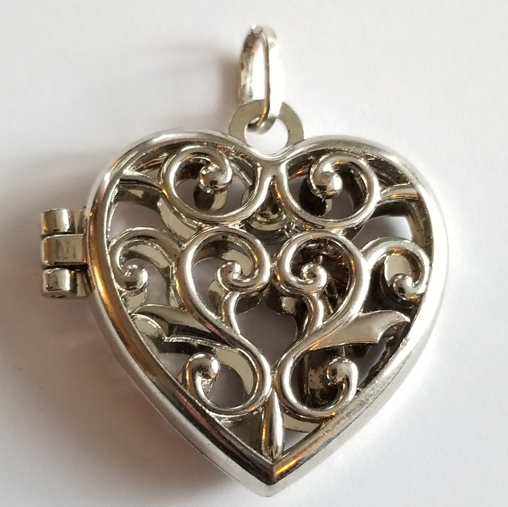 Angel locket pendant silver tone heart scrolled cutout